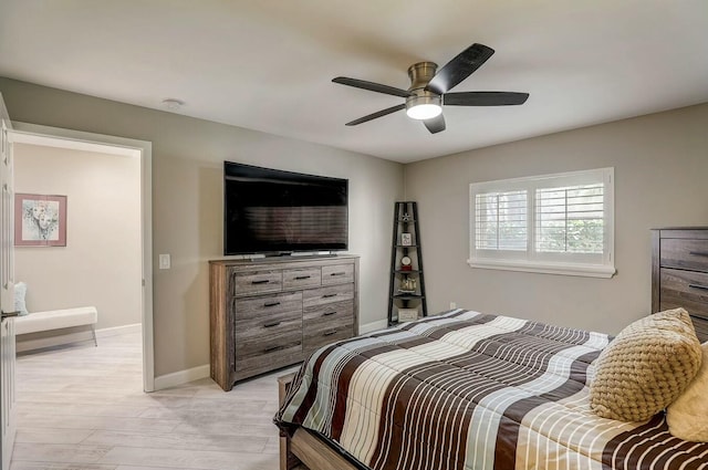 bedroom with ceiling fan and light wood-type flooring