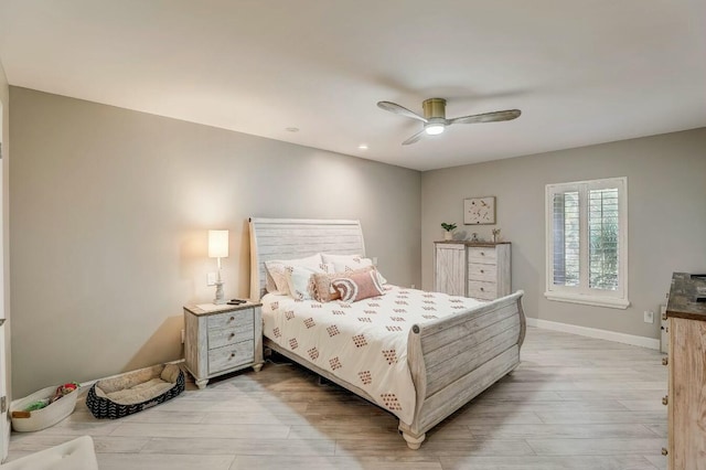 bedroom with ceiling fan and light wood-type flooring