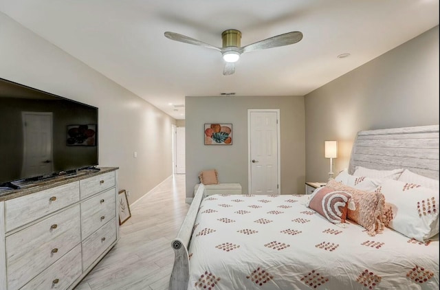 bedroom with light wood-type flooring and ceiling fan