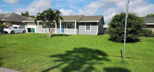 ranch-style home with a front yard, a porch, and a garage