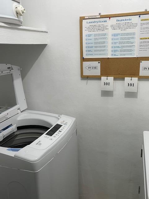 clothes washing area featuring washer / dryer