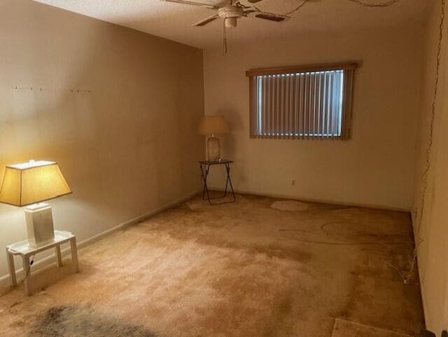 unfurnished room with carpet and ceiling fan