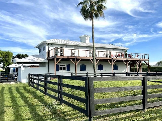 rear view of house with a lawn