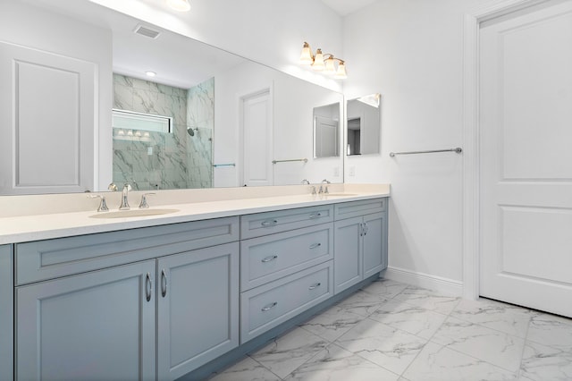 bathroom with vanity and a shower with shower door