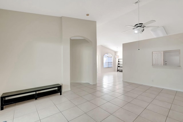 unfurnished room featuring ceiling fan, light tile patterned flooring, and high vaulted ceiling