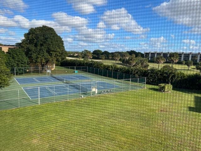 view of sport court featuring a yard