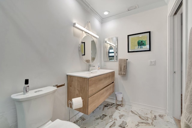 bathroom with vanity, toilet, and crown molding