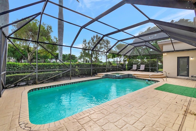 view of pool with a lanai and a patio area