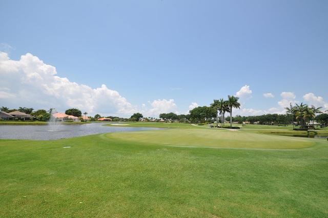 view of community featuring a yard and a water view