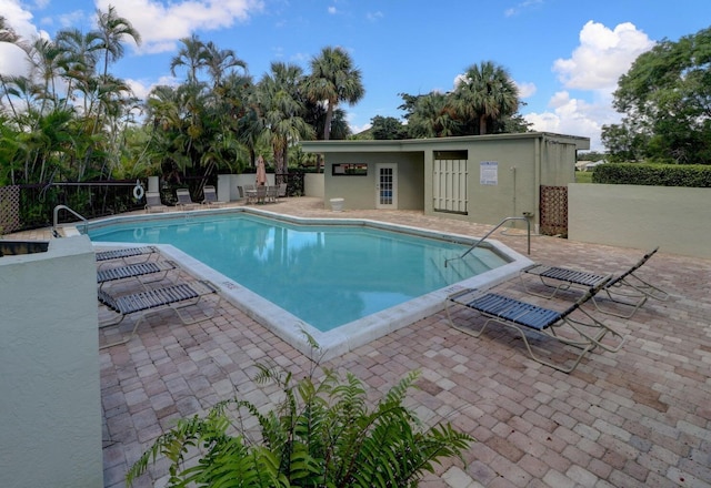 view of swimming pool featuring a patio area