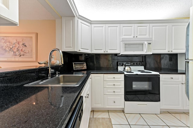 kitchen featuring white appliances, white cabinets, sink, decorative backsplash, and light tile patterned flooring