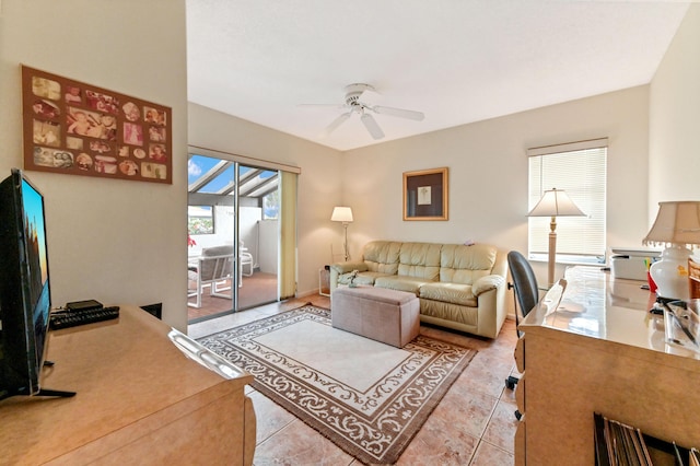 tiled living room featuring ceiling fan