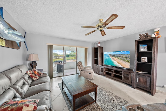 tiled living room with ceiling fan and a textured ceiling