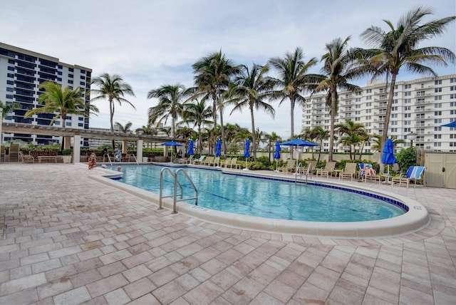 community pool with a patio area