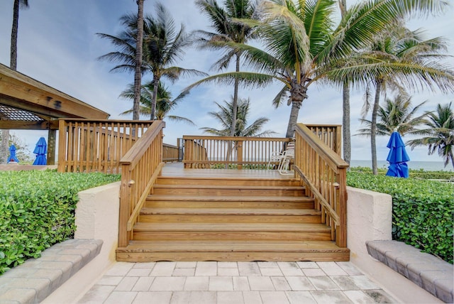 wooden terrace featuring stairs