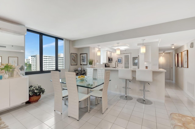 dining room featuring light tile patterned floors and visible vents