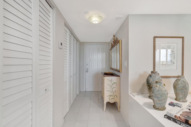 hallway featuring light tile patterned flooring