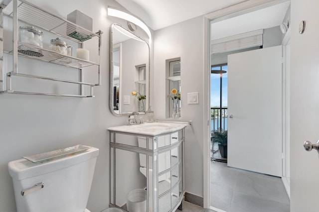 bathroom featuring toilet and vanity