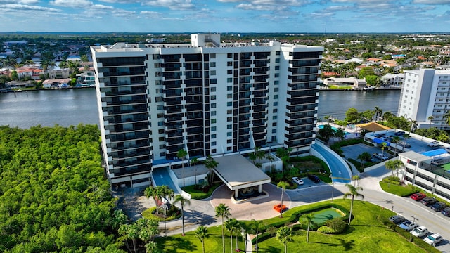 birds eye view of property with a water view