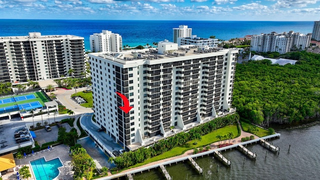 aerial view featuring a view of city and a water view