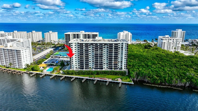 bird's eye view featuring a view of city and a water view