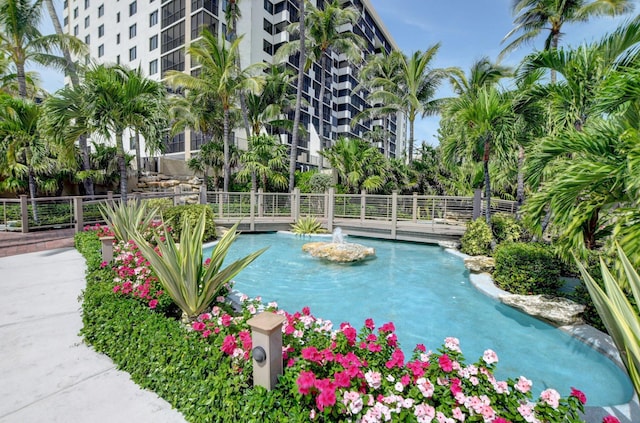 view of pool featuring fence