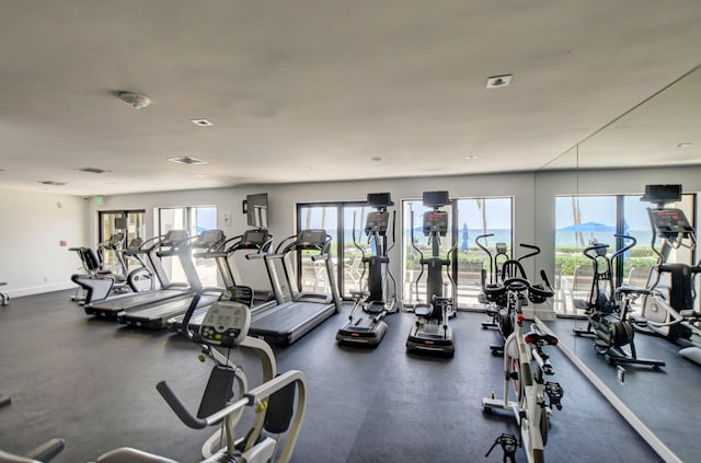 workout area featuring baseboards