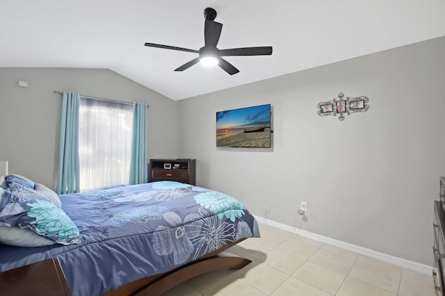 bedroom featuring ceiling fan, light tile patterned flooring, and lofted ceiling