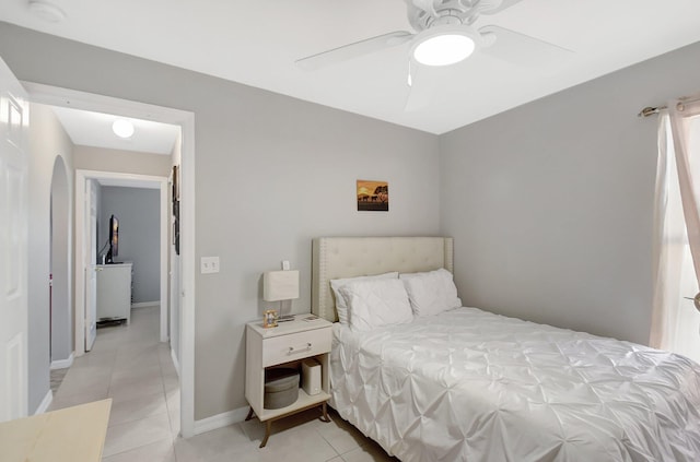 bedroom featuring ceiling fan and light tile patterned floors