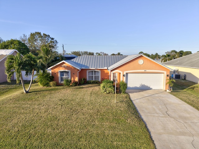 ranch-style home with a garage and a front yard