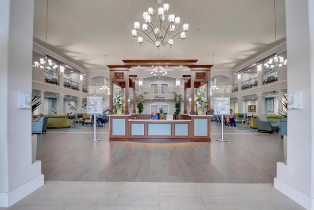 reception area featuring an inviting chandelier