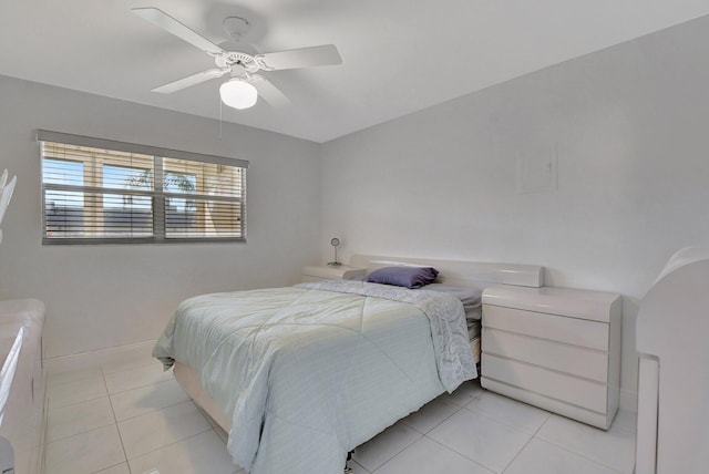 tiled bedroom with ceiling fan