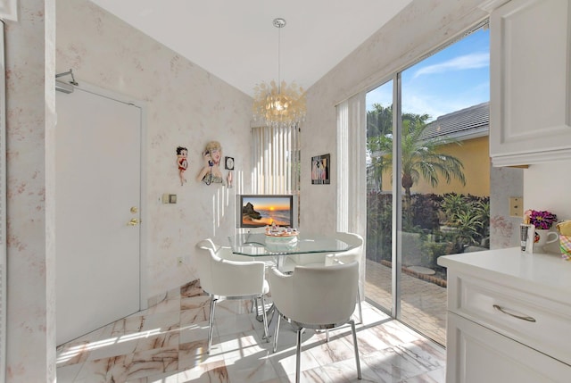 dining space with a notable chandelier