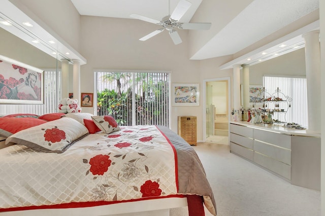 carpeted bedroom featuring access to exterior, ceiling fan, ensuite bath, and a high ceiling