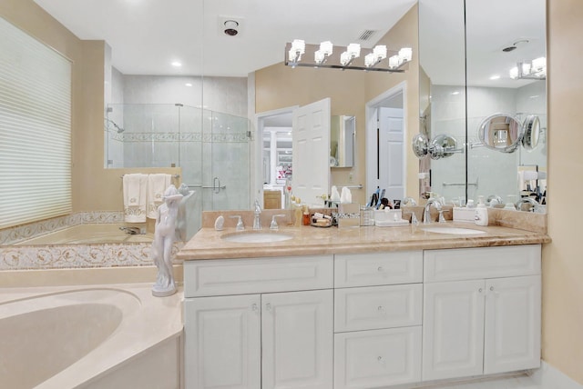 bathroom featuring vanity and separate shower and tub