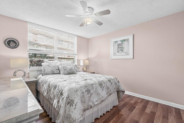 bedroom featuring a textured ceiling, dark hardwood / wood-style flooring, and ceiling fan