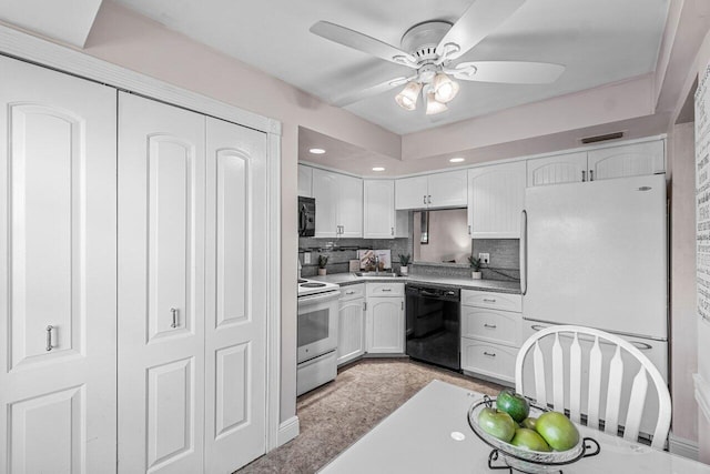 kitchen featuring white cabinetry, sink, ceiling fan, tasteful backsplash, and black appliances