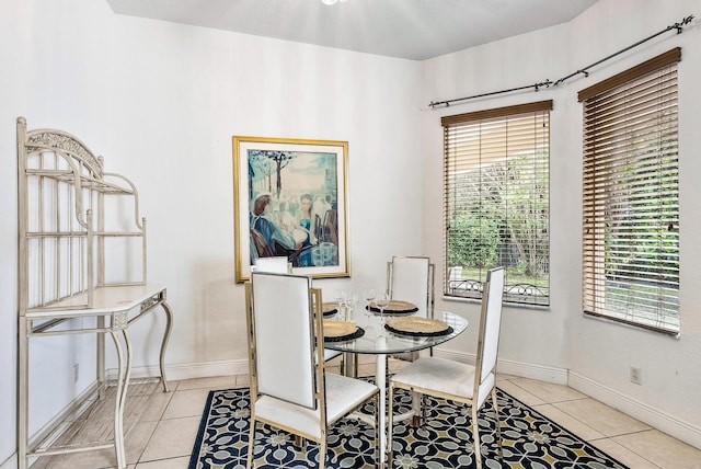 dining space featuring light tile patterned floors and a wealth of natural light