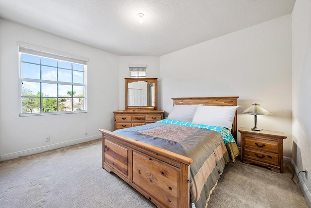 carpeted bedroom with a textured ceiling