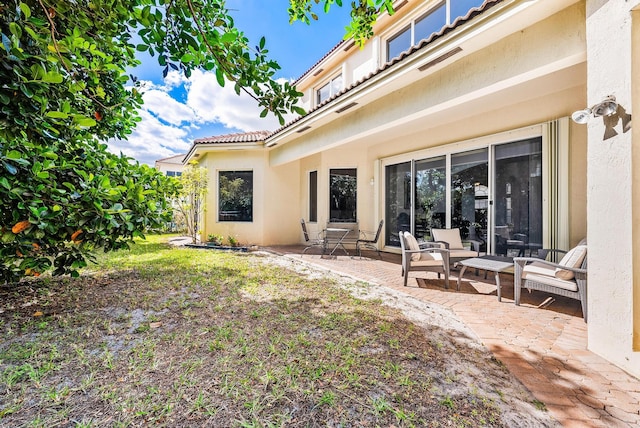 back of house featuring a patio area