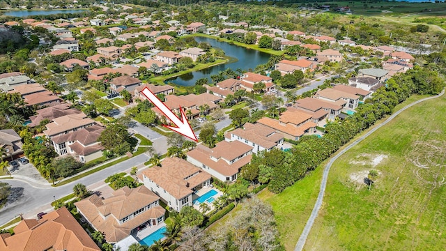 birds eye view of property featuring a water view