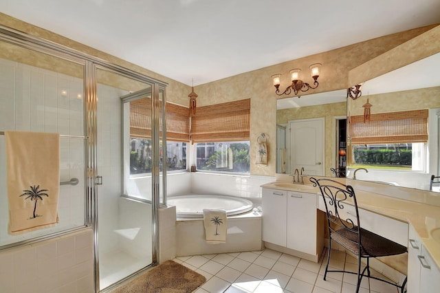 bathroom with separate shower and tub, a wealth of natural light, tile patterned floors, and vanity