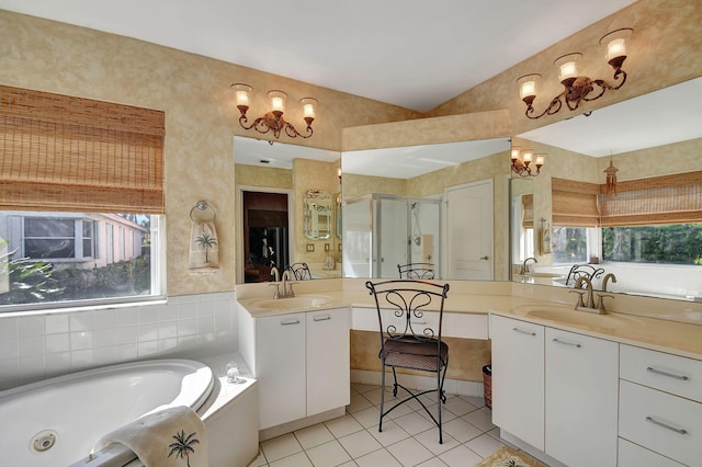 bathroom with tile patterned floors, vanity, shower with separate bathtub, and a wealth of natural light