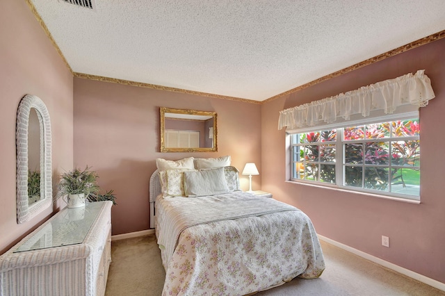 carpeted bedroom with crown molding and a textured ceiling