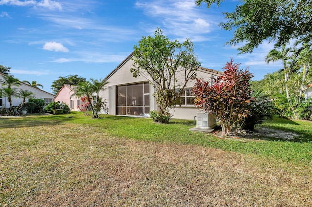 view of yard featuring a sunroom