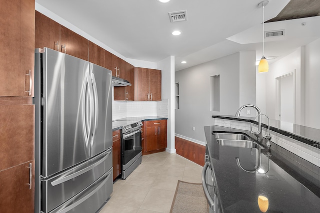 300 S Australian Ave Unit 520, West Palm Beach, FL 33401 - kitchen featuring appliances with stainless steel finishes, a sink, exhaust hood, light tile patterned flooring, and pendant lighting
