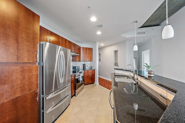 kitchen with sink, stainless steel appliances, hanging light fixtures, and light tile patterned flooring