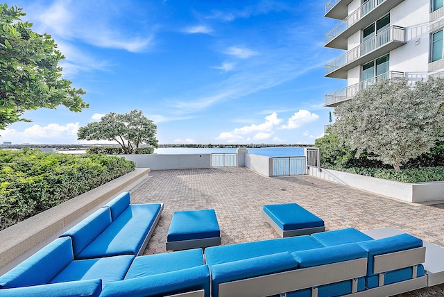 view of patio / terrace featuring an outdoor living space and a water view