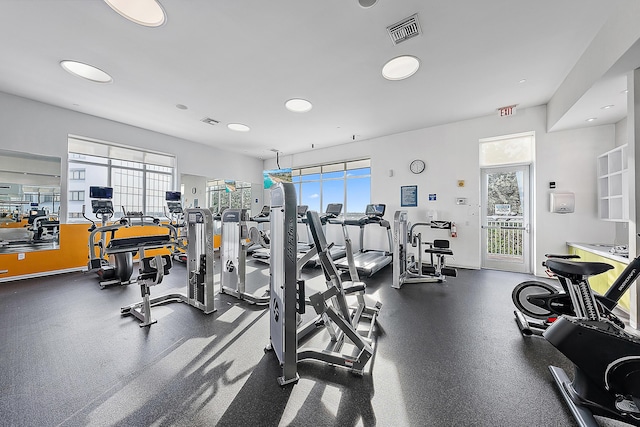 workout area featuring plenty of natural light and visible vents