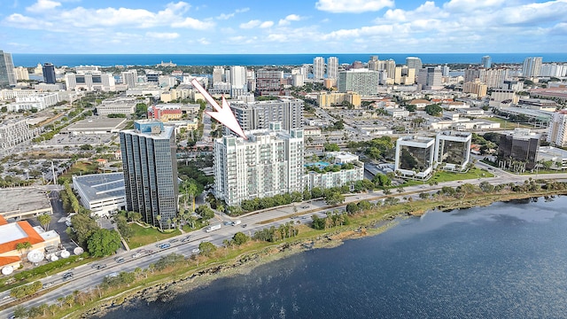 birds eye view of property with a water view